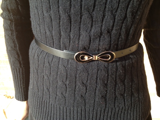 black cable knit sweater with bow belt